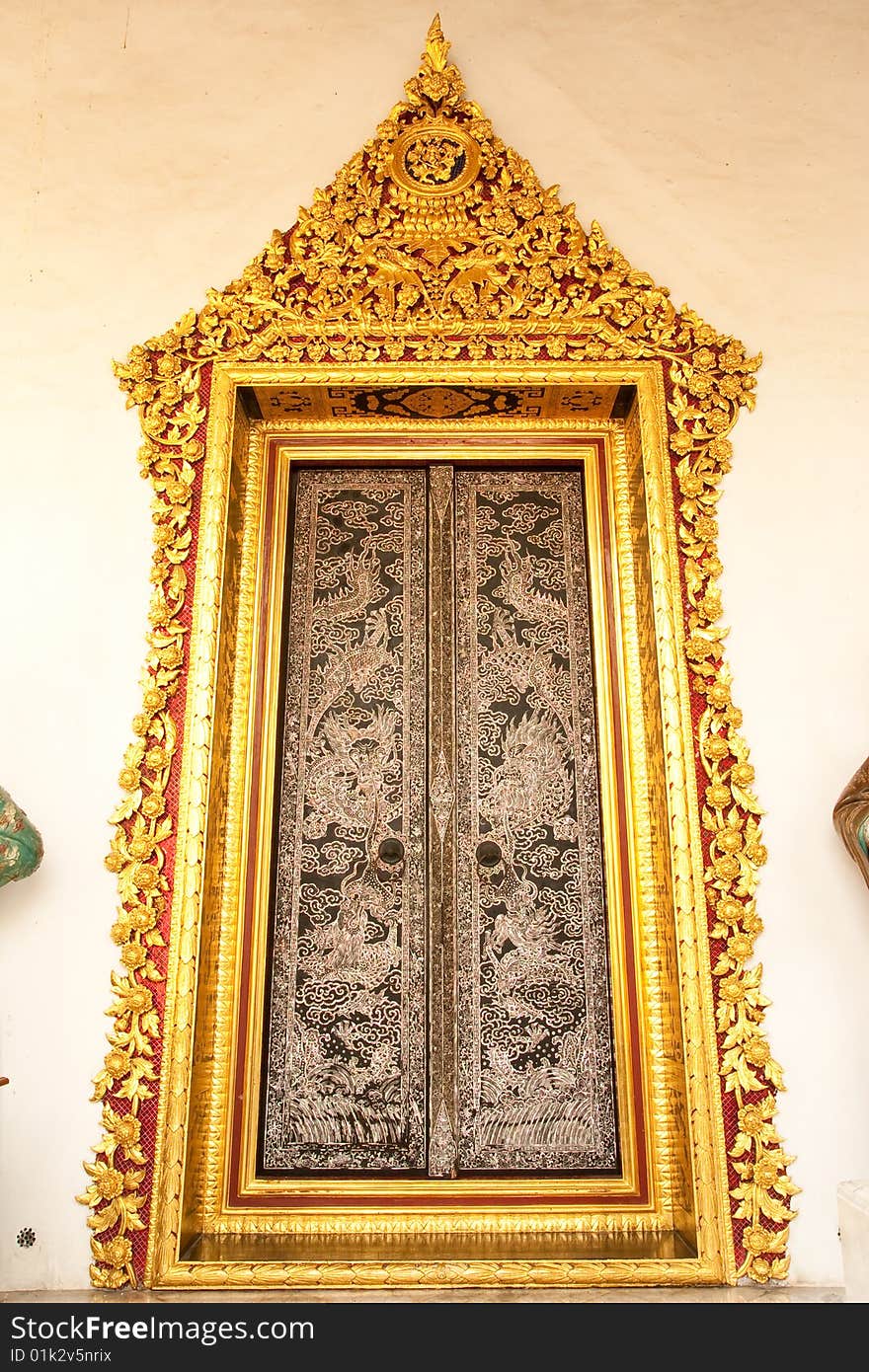 Traditional Thai art door in Buddhist temple, Bangkok, Thailand