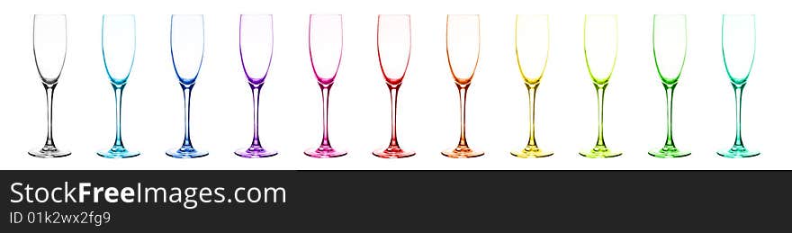 Set of multi-coloured glasses for champagne: red, orange, yellow, green, blue, dark blue, violet, pink, aquamarine, grey, citril. Over white. Set of multi-coloured glasses for champagne: red, orange, yellow, green, blue, dark blue, violet, pink, aquamarine, grey, citril. Over white.