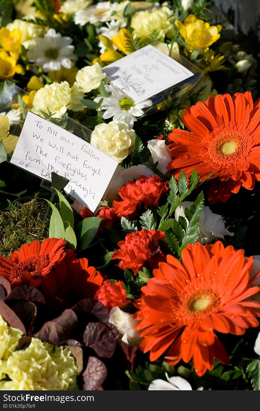 Flowers and notes reading remembrance messages to soldiers who died in the war. Flowers and notes reading remembrance messages to soldiers who died in the war