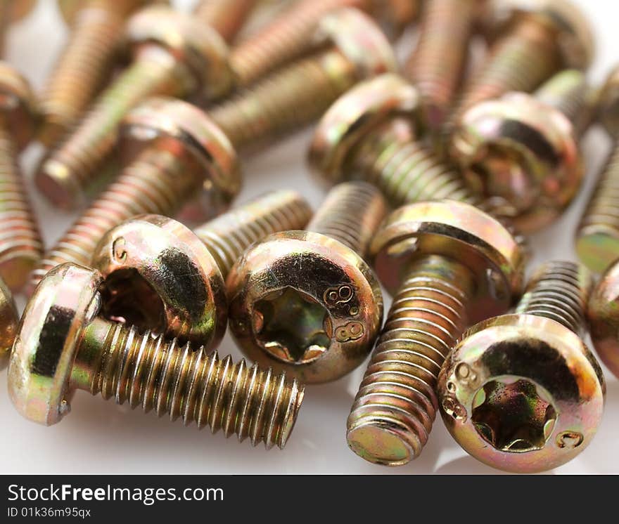 Metal bolts on white background