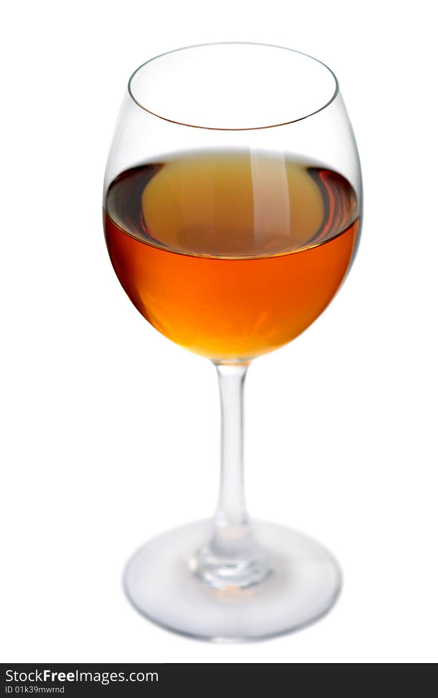 Glass of excellent white wine on a white background