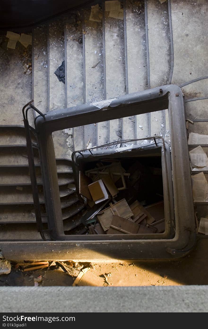 Old stairway, leave company building with files on stair