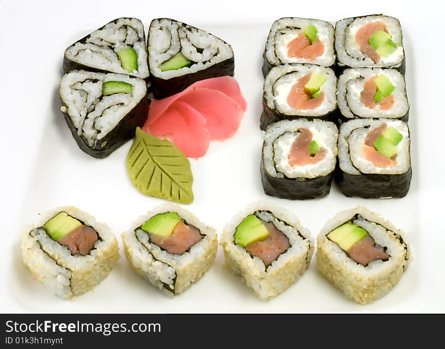 A selection of rolls sushi against a white background