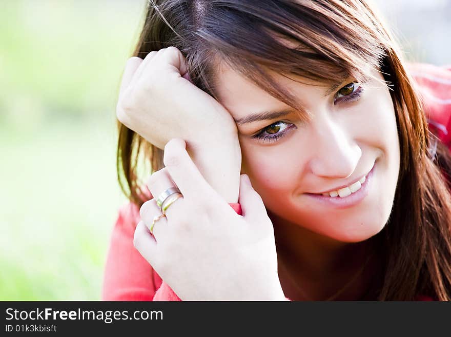 Smiling young girl staring at camera. Smiling young girl staring at camera.