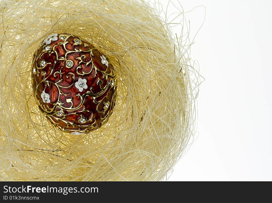 Metal egg in a nest. Metal egg in a nest