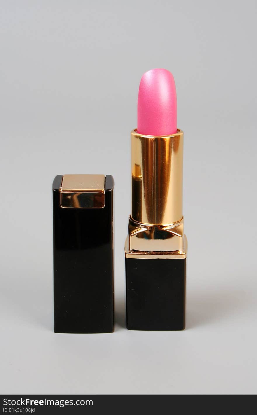 Pink lipstick on a grey background. Pink lipstick on a grey background