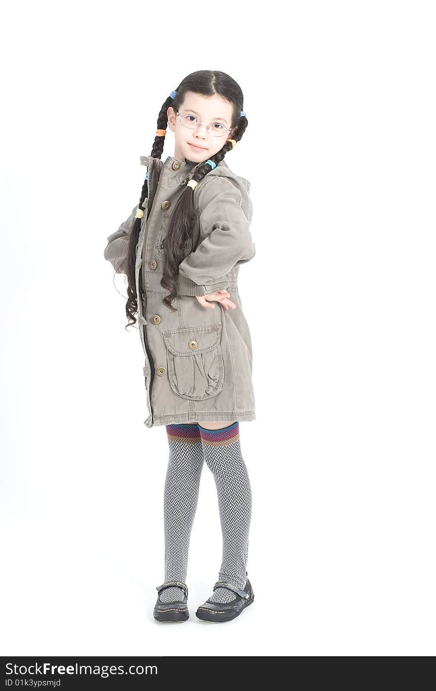 Beautiful little girl is posing over white