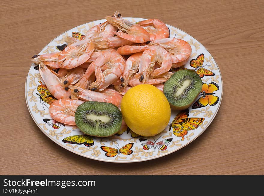 Plate is full of cooked prawns