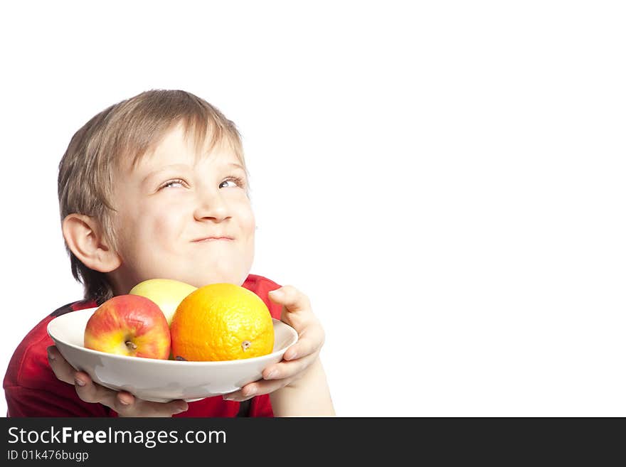 Isolated boy holding plate with fruits over white background. Isolated boy holding plate with fruits over white background