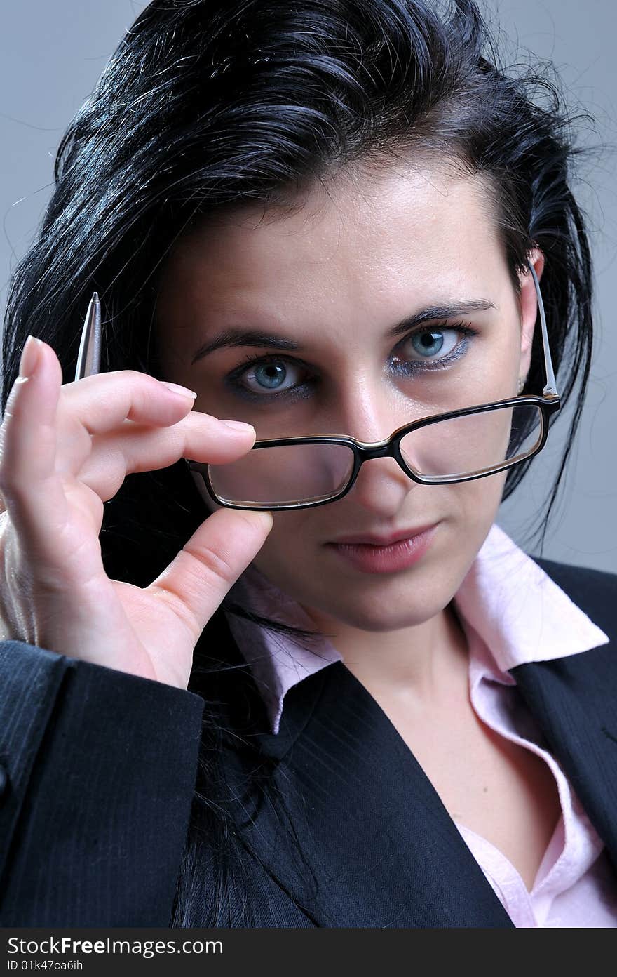 Close up portrait of beautiful business women looking over glasses. Close up portrait of beautiful business women looking over glasses