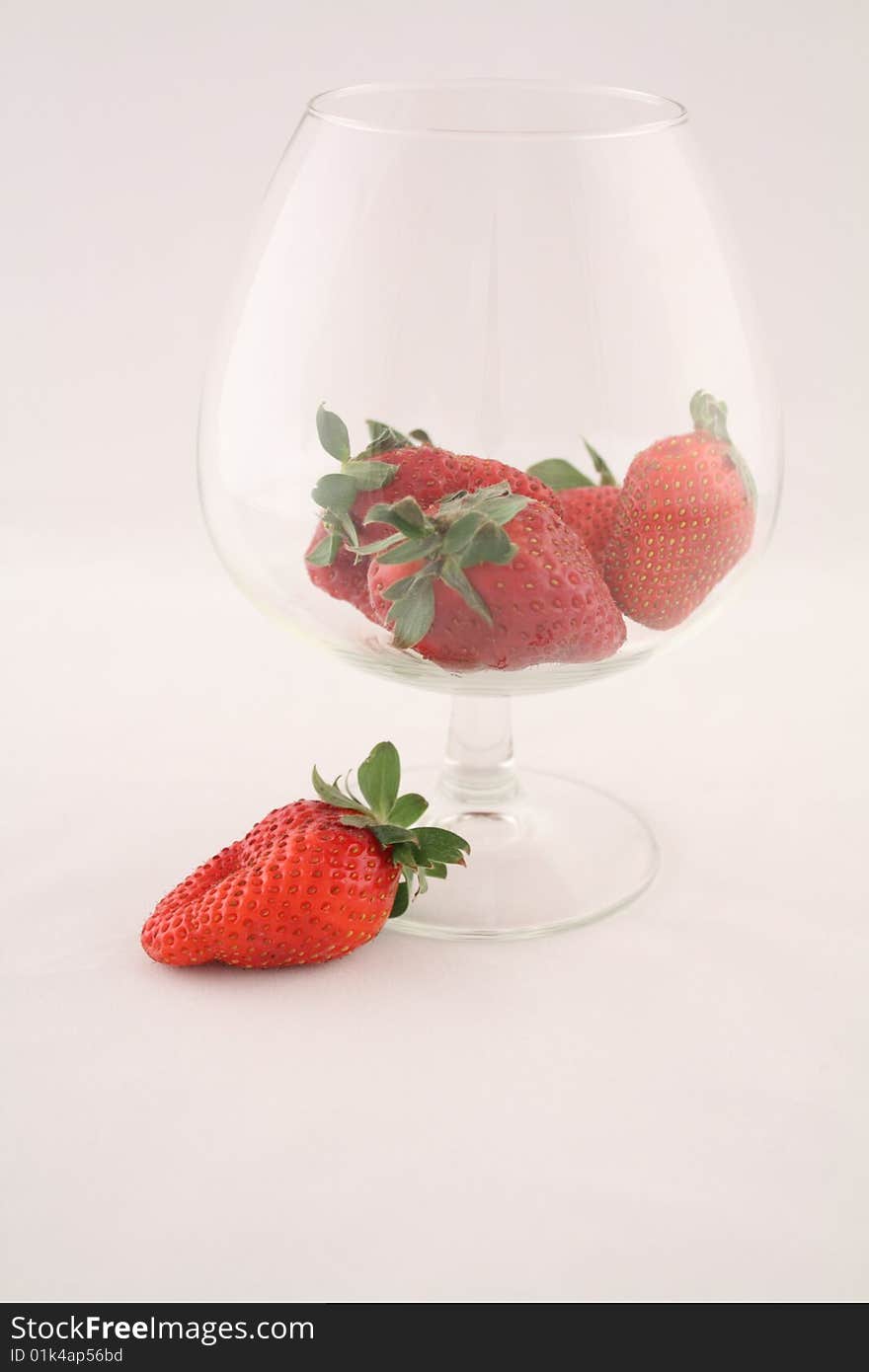 Strawberry in a glass it is isolated on the white