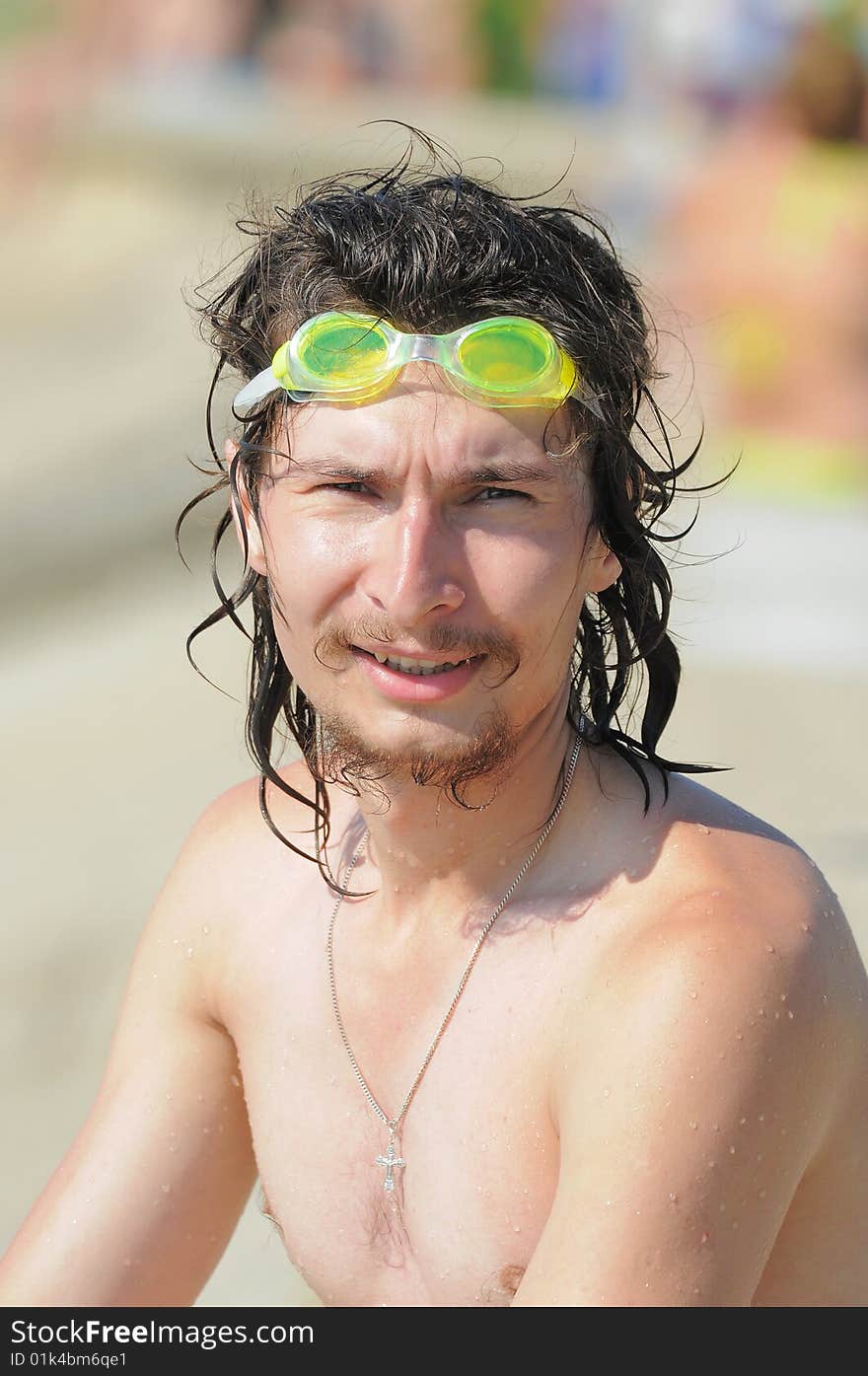 The man. The cheerful young man with long wet hair after bathing. The man. The cheerful young man with long wet hair after bathing.