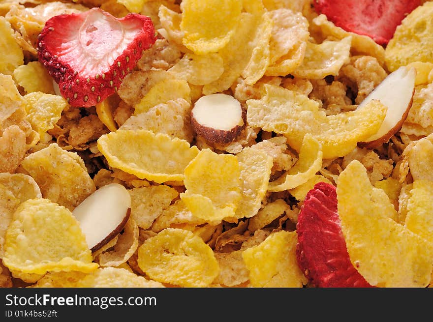 Cornflakes cereal with fruits and nuts make a healthy American breakfast. Cornflakes cereal with fruits and nuts make a healthy American breakfast