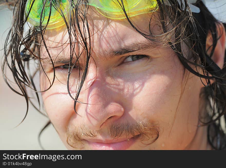 The man. The cheerful young man with long wet hair after bathing. The man. The cheerful young man with long wet hair after bathing.