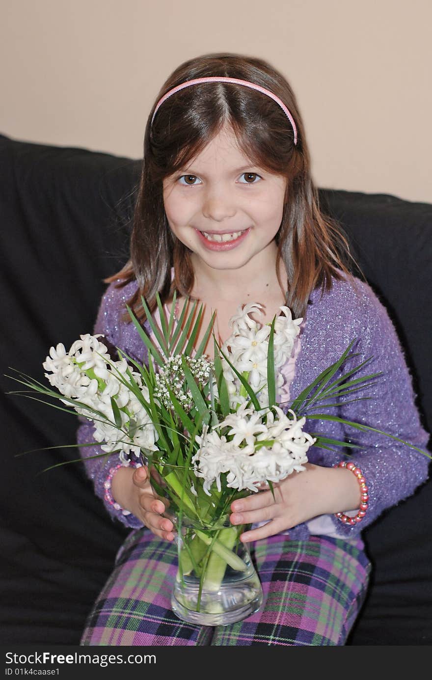 A portrait with a beautiful girl with spring flowers. A portrait with a beautiful girl with spring flowers