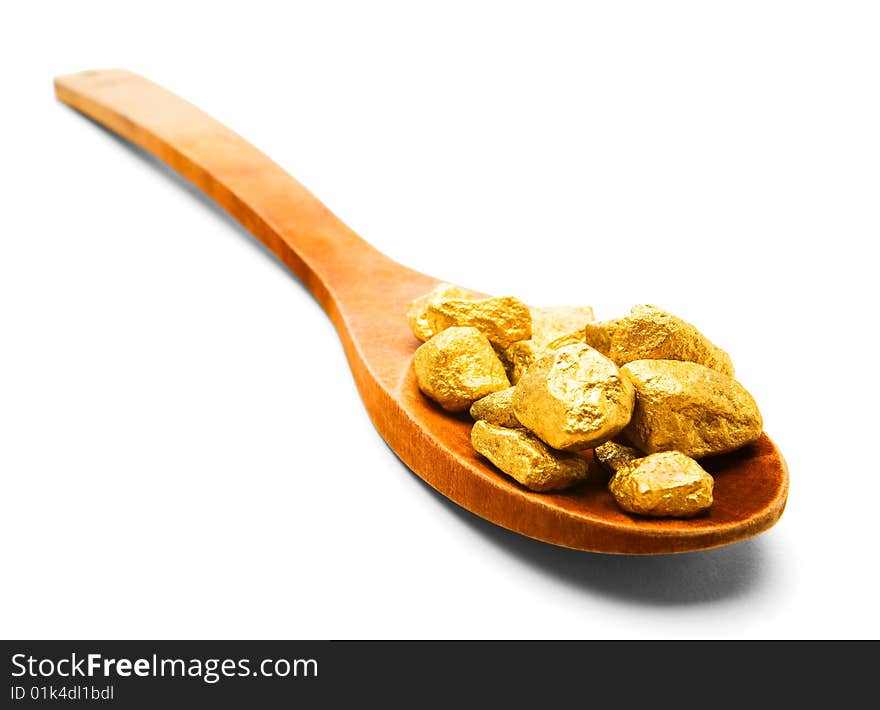 Gold Pieces In A Wooden Spoon