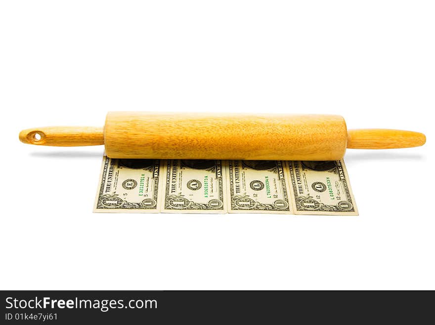 Close-up of a rolling pin on us paper currency isolated over white. Close-up of a rolling pin on us paper currency isolated over white