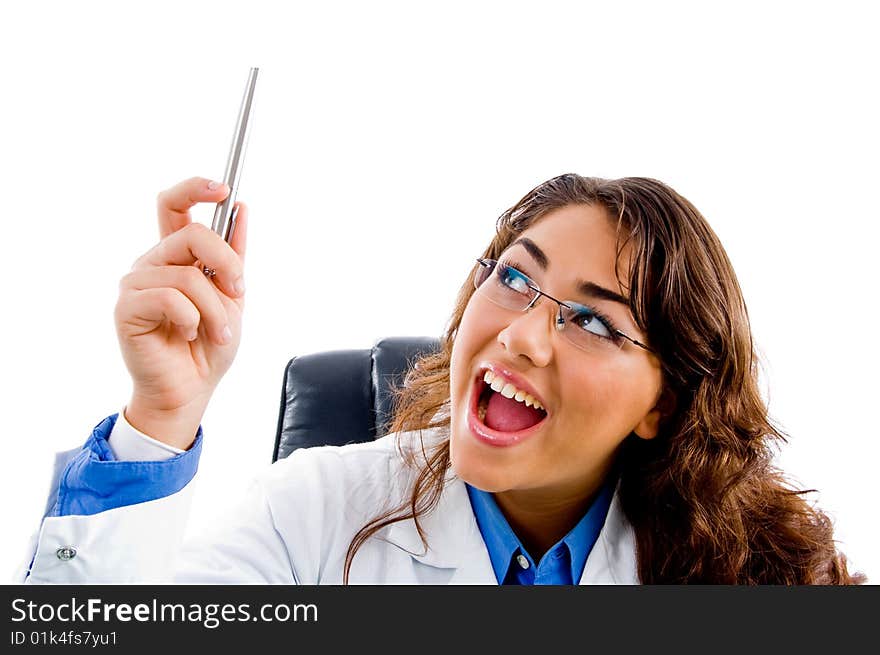 Smiling doctor looking the pen on an isolated background