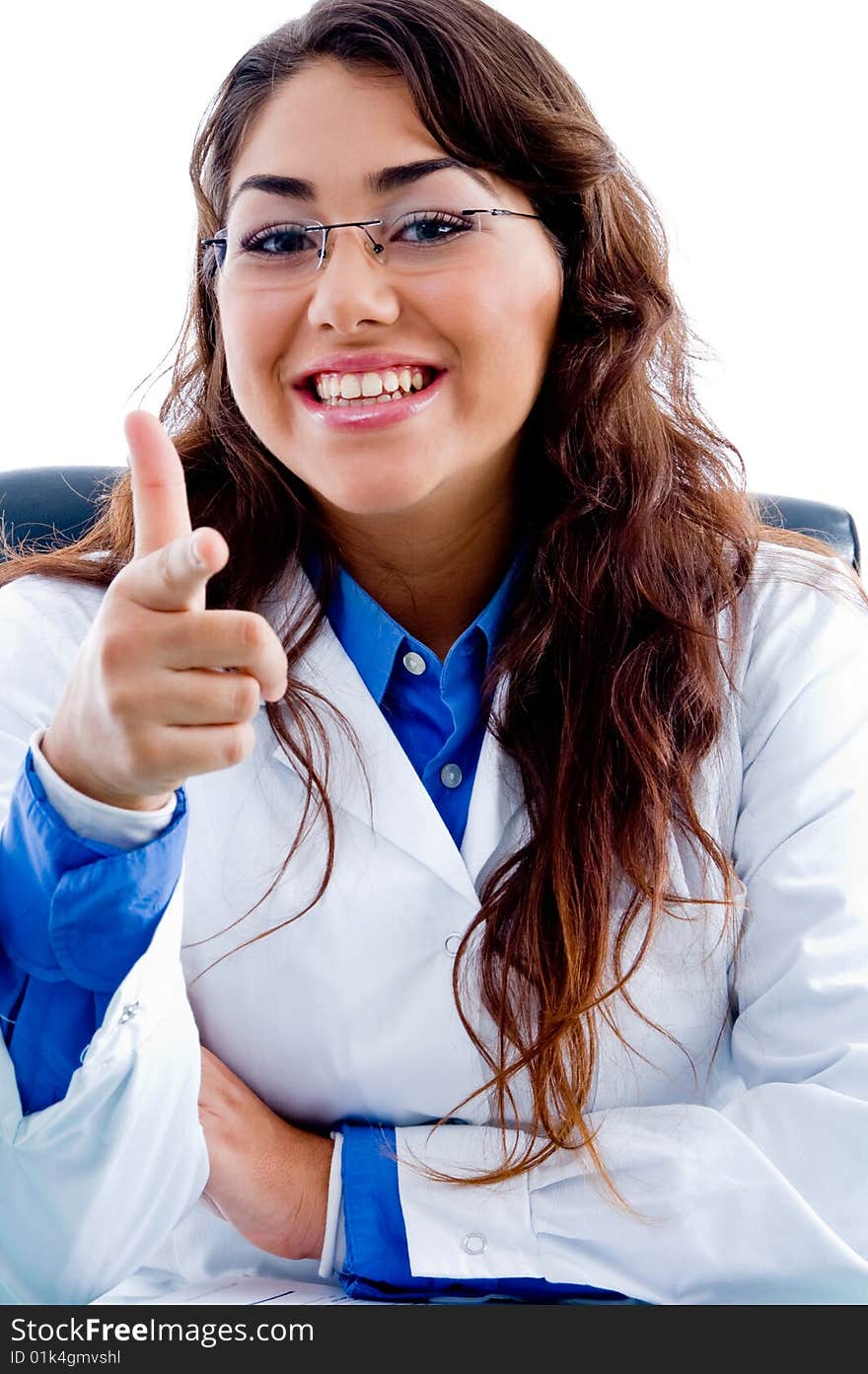 Medical Doctor smiling at camera sitting on chair