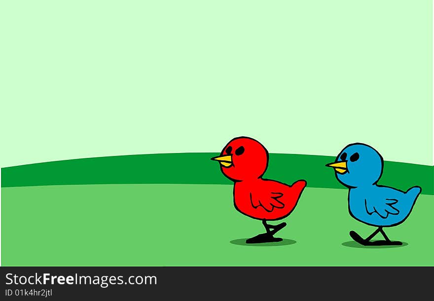 Red and blue chicks walking on meadow