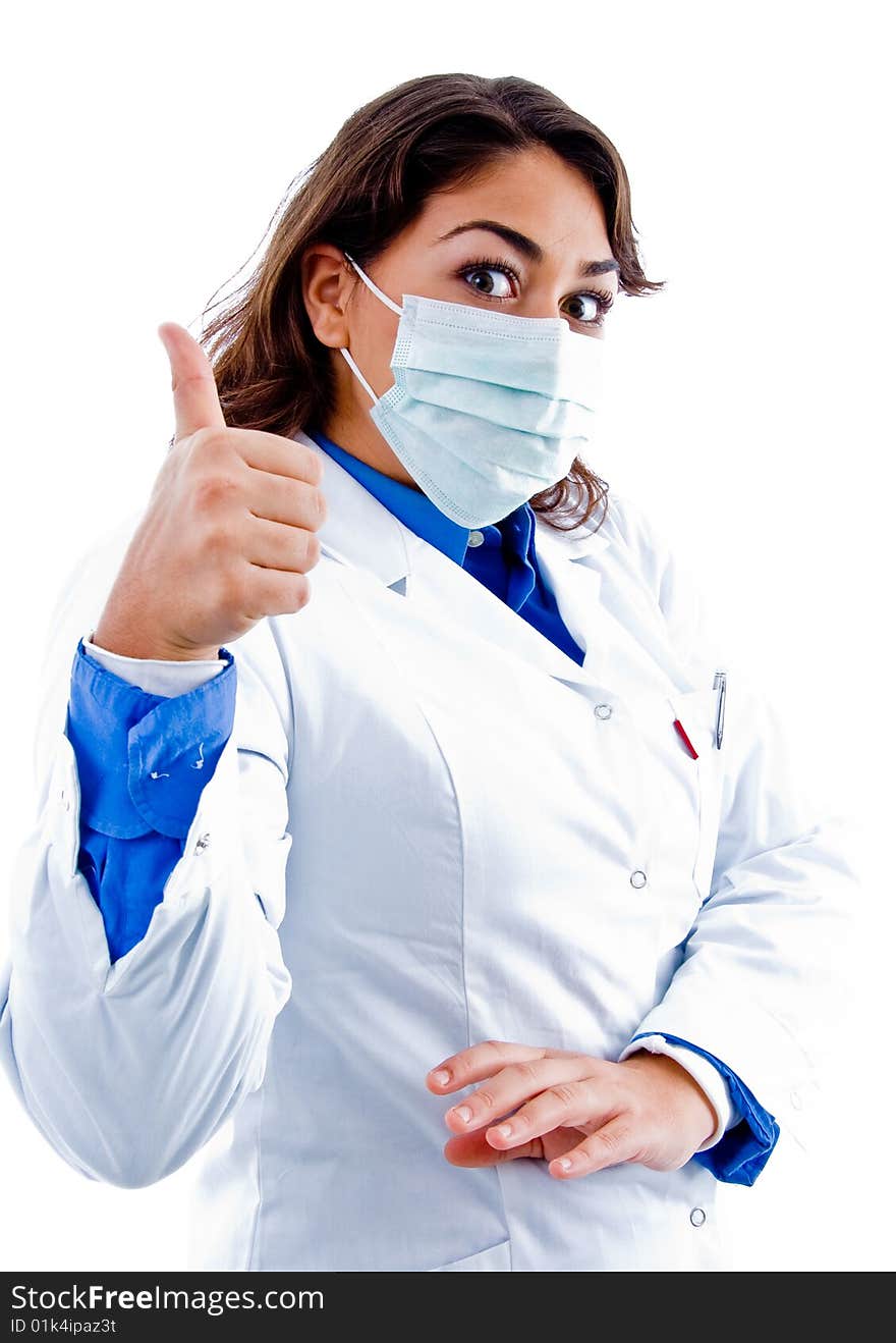 Side pose of doctor with mask and thumbs up on an isolated background