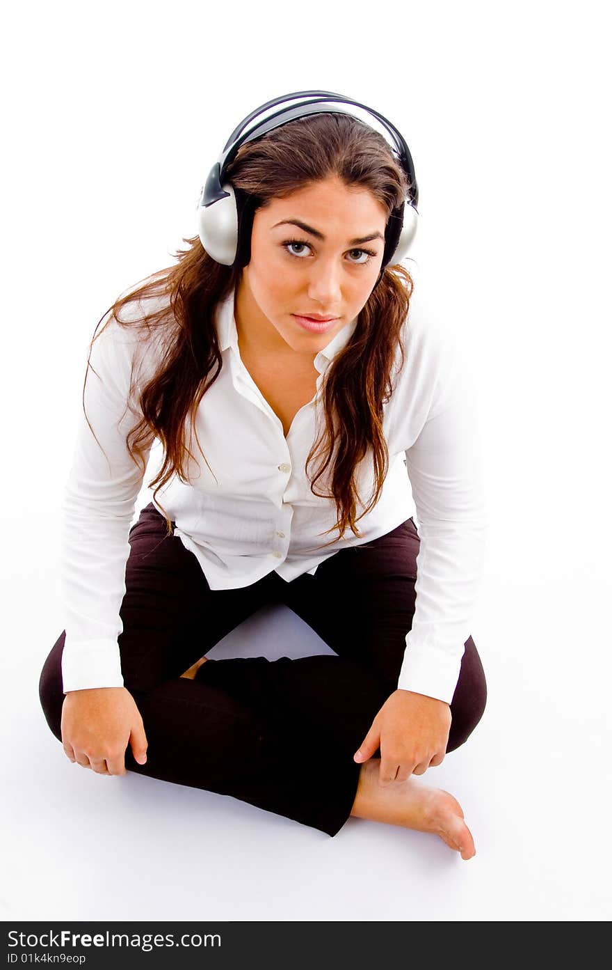 Cute girl posing with headphones against white background. Cute girl posing with headphones against white background