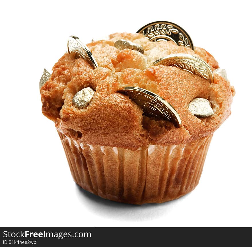 Coins of chocolate on a cupcake isolated over white. Coins of chocolate on a cupcake isolated over white