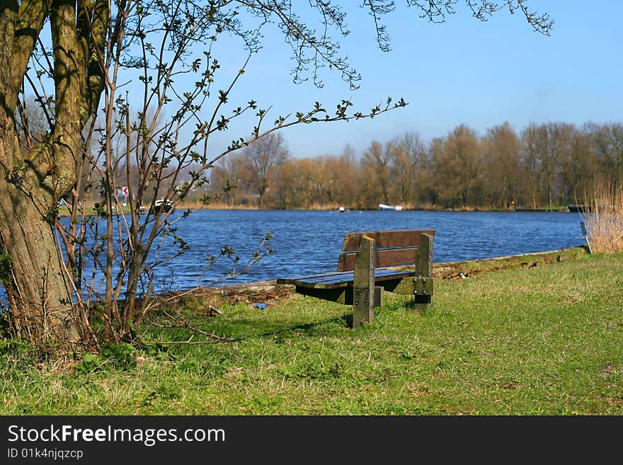 Bench at the sunny watersite. Bench at the sunny watersite