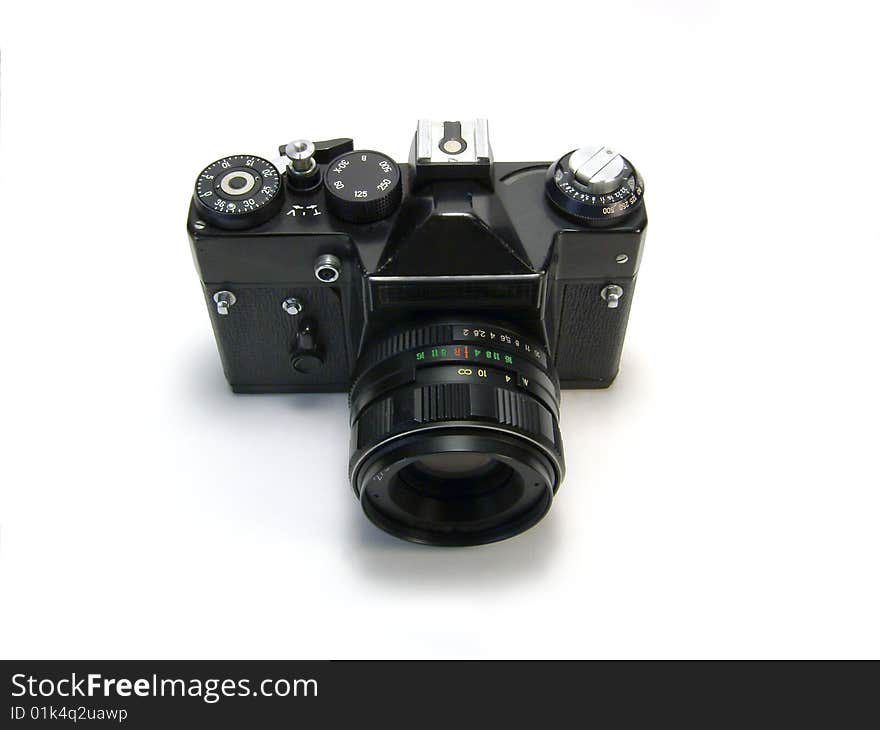 Black photo camera isolated over white background.