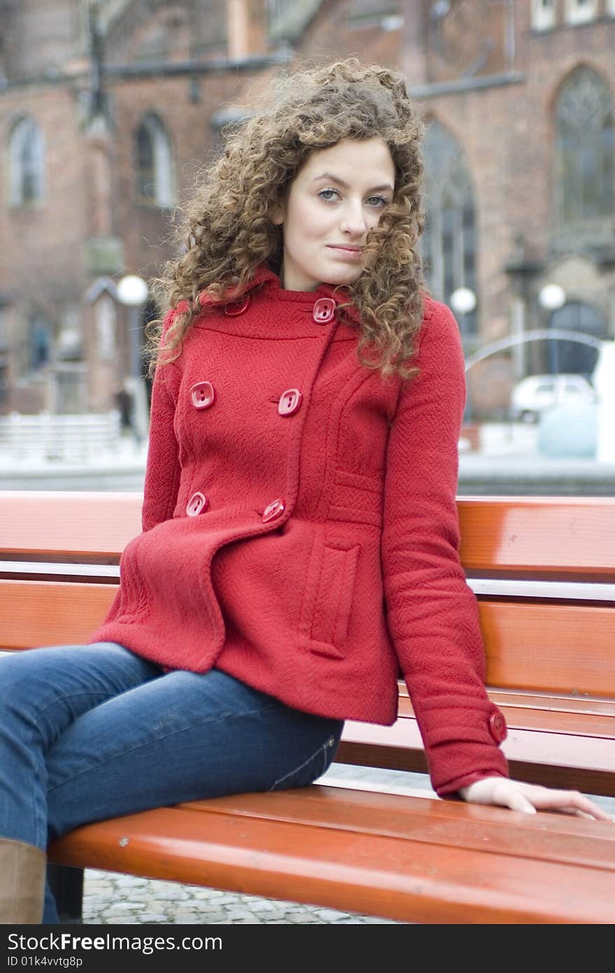 Young Girl Sitting On Bank