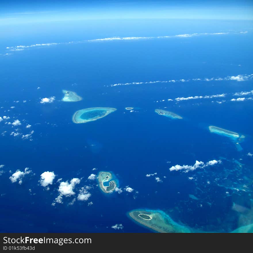 Blue sky, blue ocean, and coralline island in western pacific ocean. Blue sky, blue ocean, and coralline island in western pacific ocean