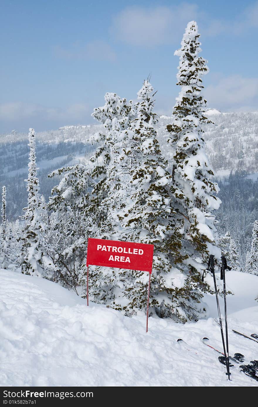 Sign Patrolled Area On Mountain Slope