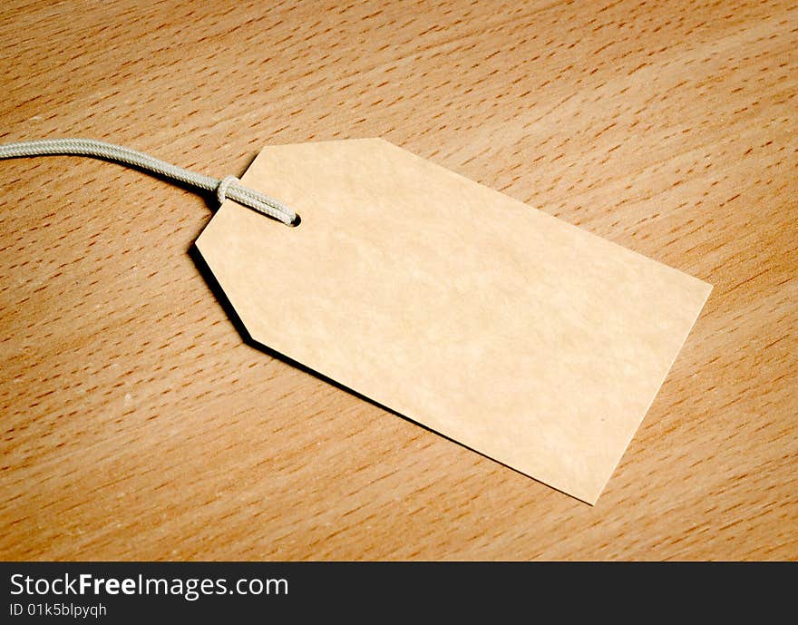 Blank tag on wooden background