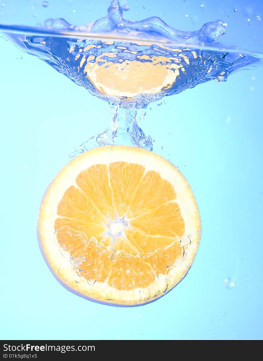 Orange with creative splashing water