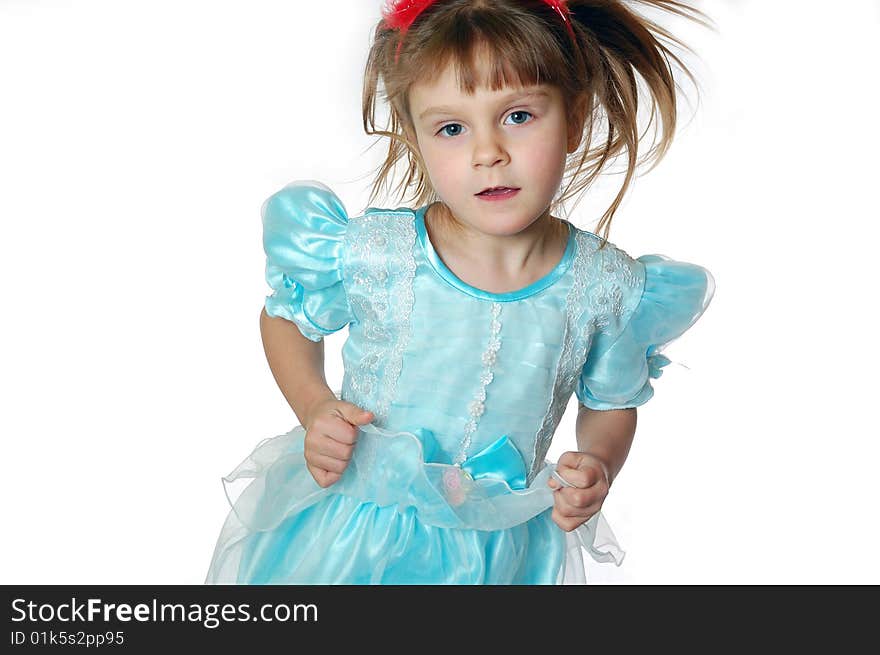 Child wearing a beautiful blue dress dancing