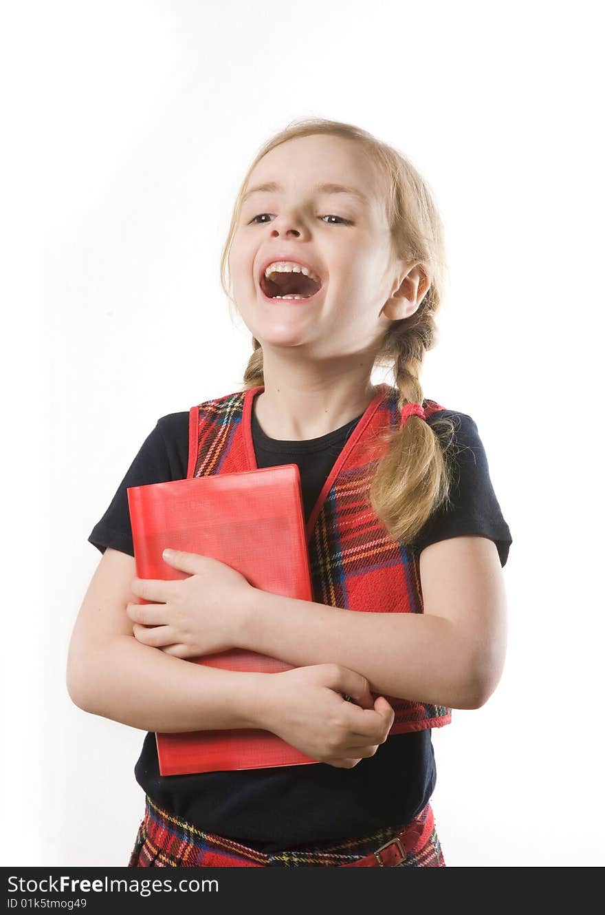 Happy schoolgirl with red book over white