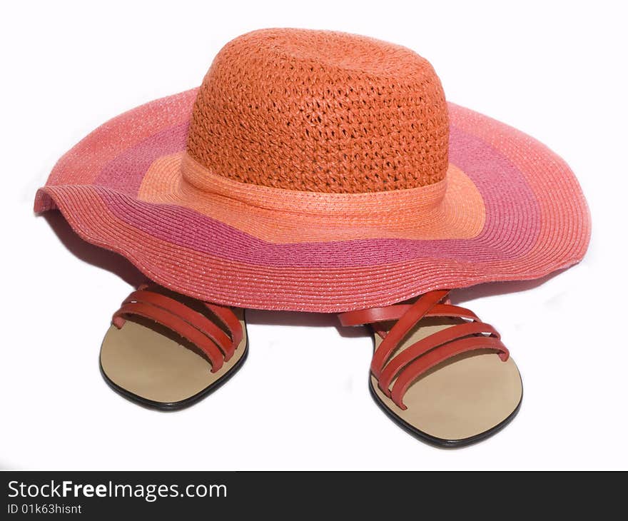 Sandals and hat on white background