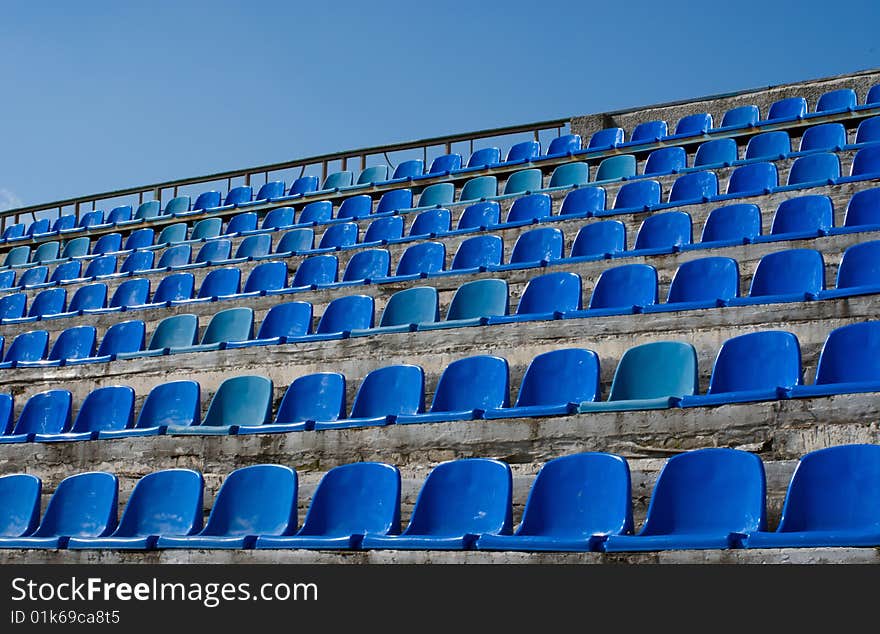 Empty seat rows of blue