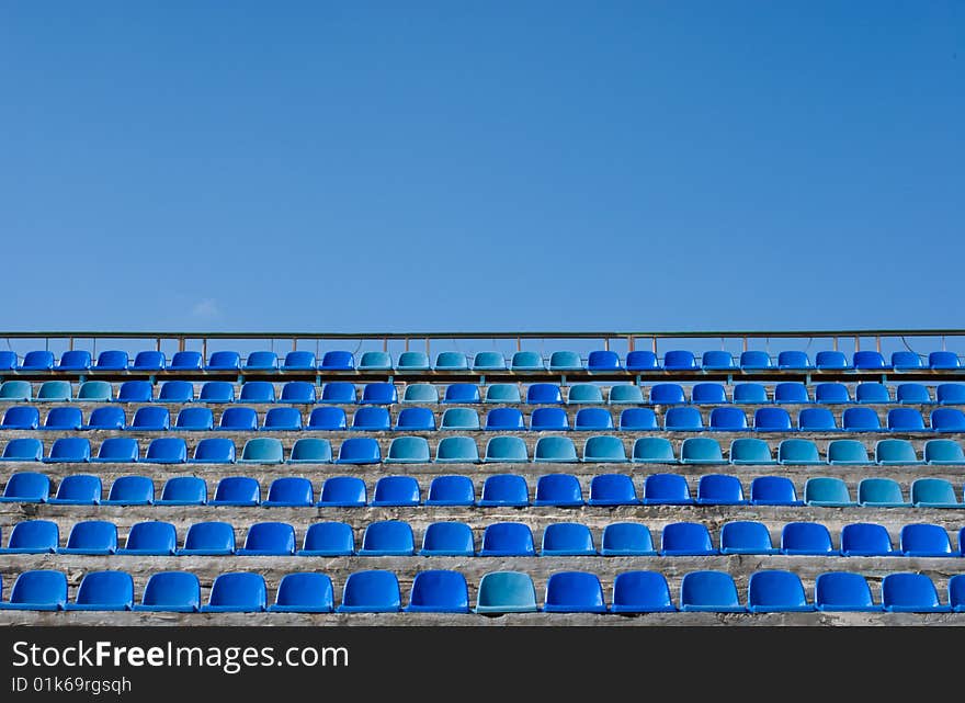 Empty tibune rows of blue. Empty tibune rows of blue