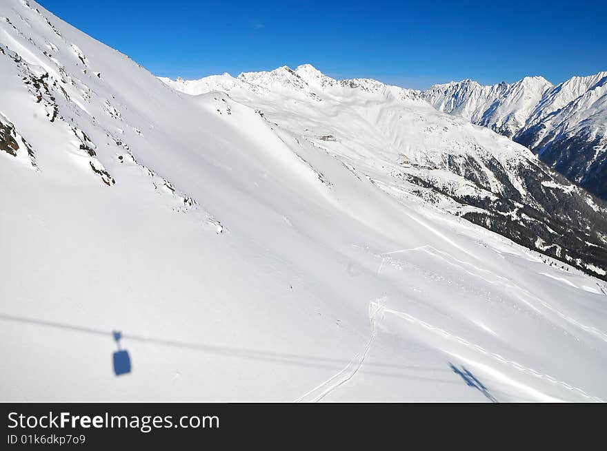 Shadow of cable car in Soelden, Austria.