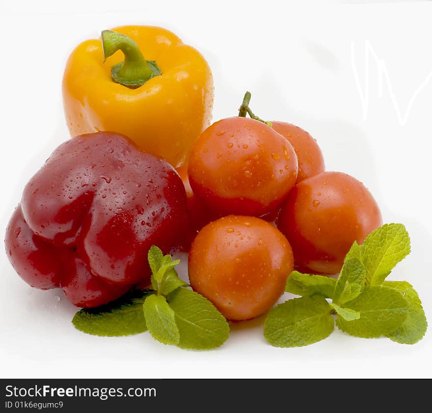 Vegetables Isolated on a white background pepper and tomatoes. Vegetables Isolated on a white background pepper and tomatoes