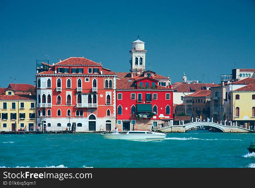 Colourful Venice embankment sea view with bridge and belfry