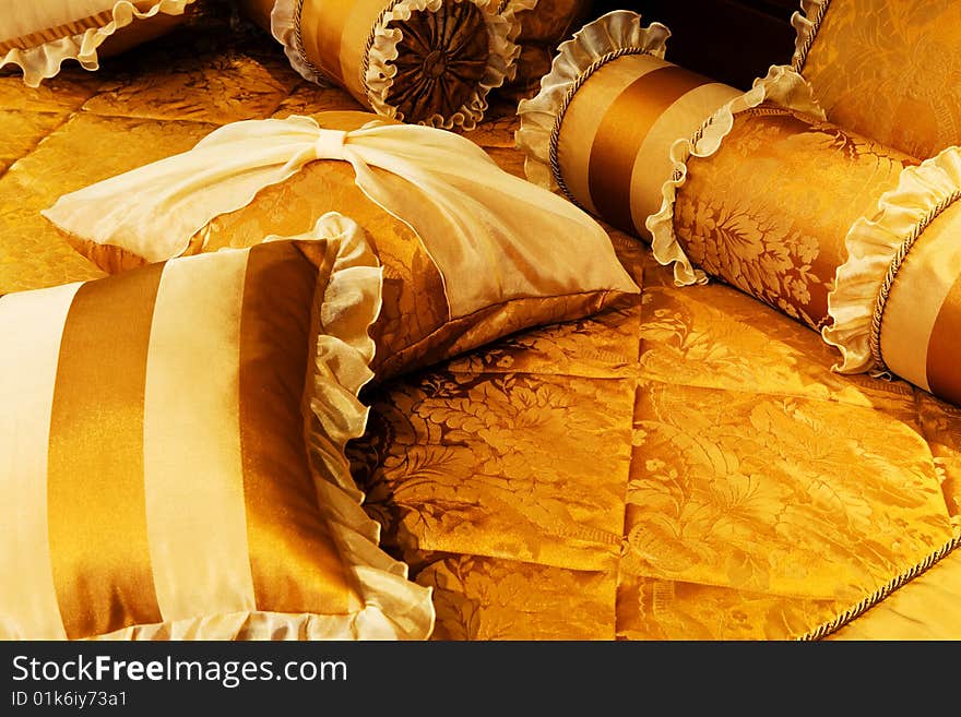 Beautiful yellow pillows on the beds of modern