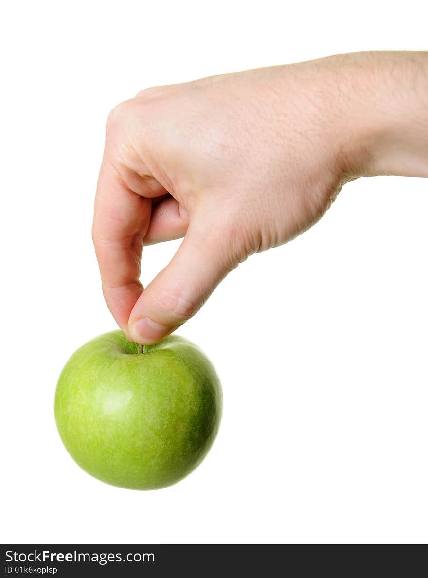 Green apple hanging from hand isolated on white background