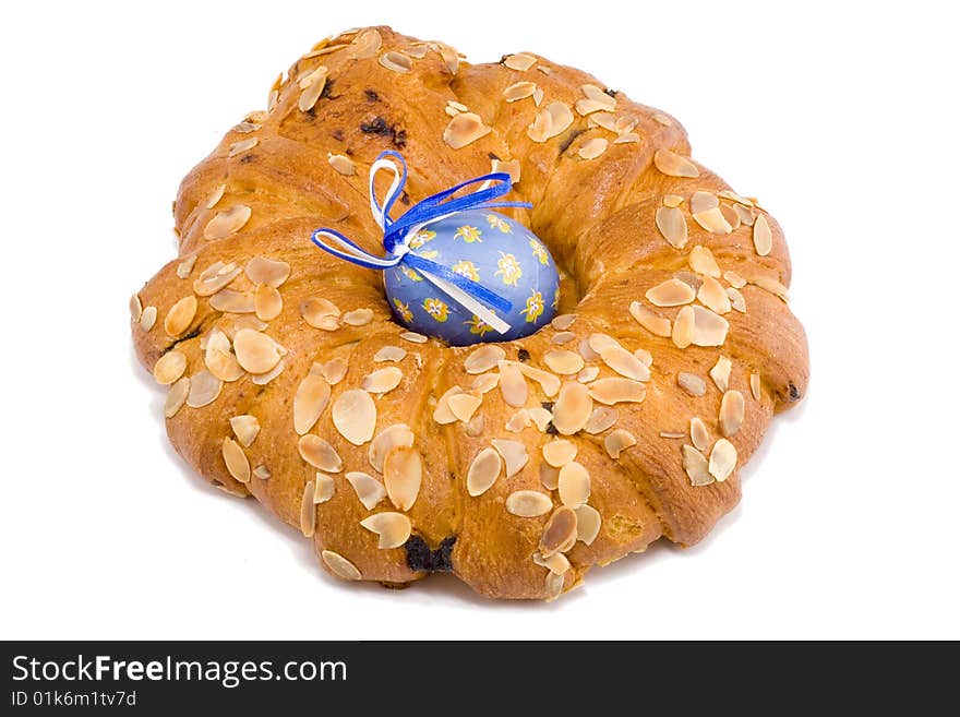 Easter pastry wreath with a blue easter egg in it. Easter pastry wreath with a blue easter egg in it