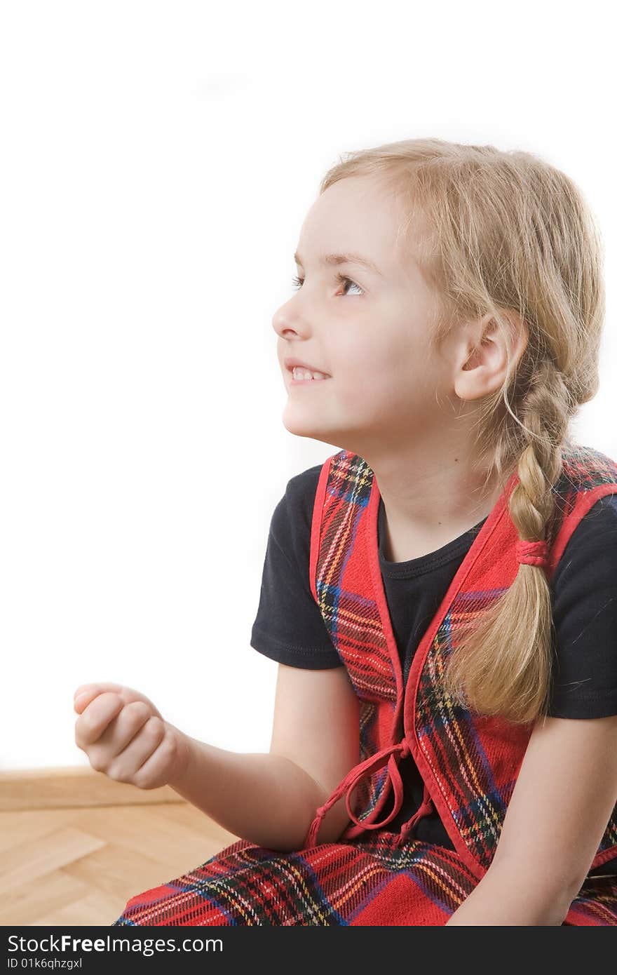 Happy schoolgirl with red book over white