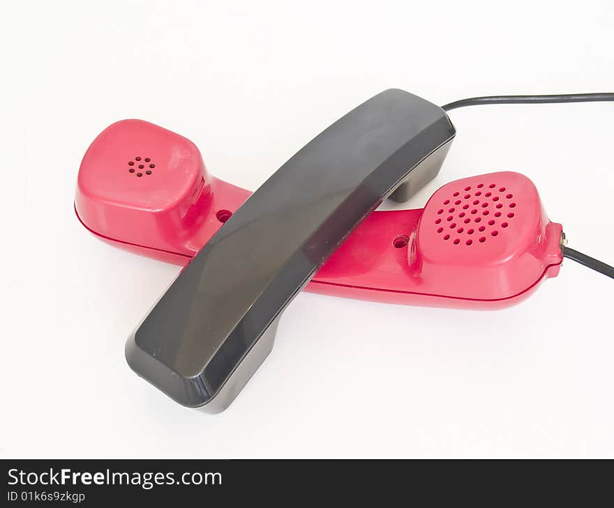 Red and black telephone isolated on white background