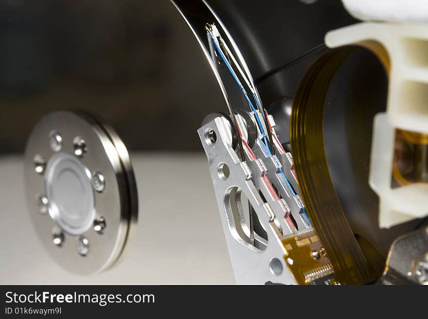 Closeup of the platters and read/write head of a computer hard drive. Closeup of the platters and read/write head of a computer hard drive