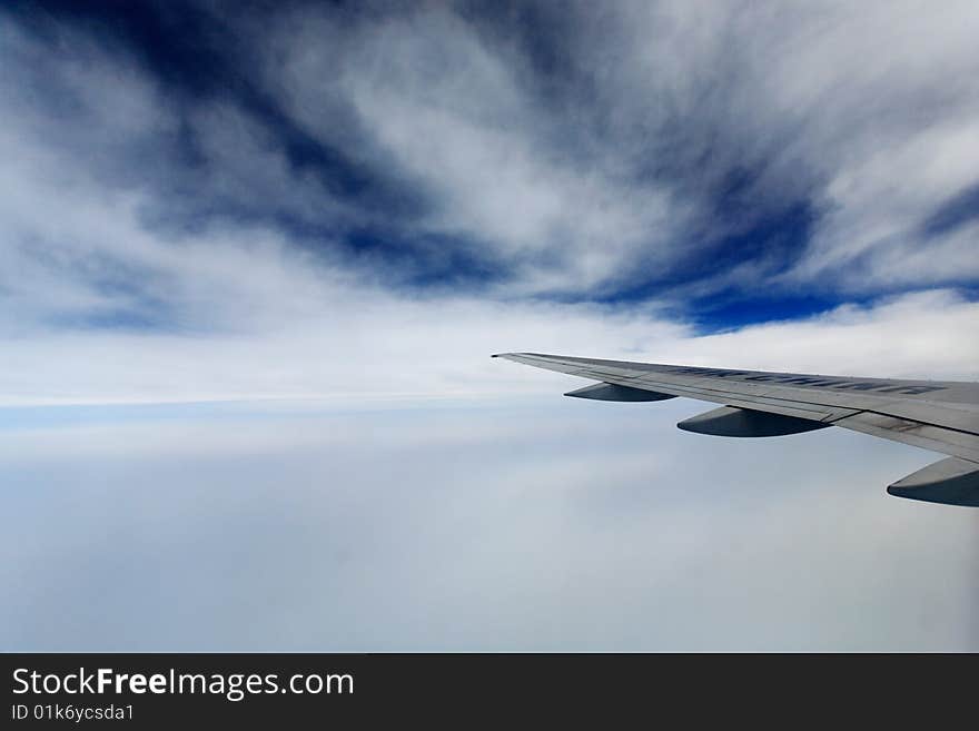 White fluffy clouds in the blue sky,view from Aircraft