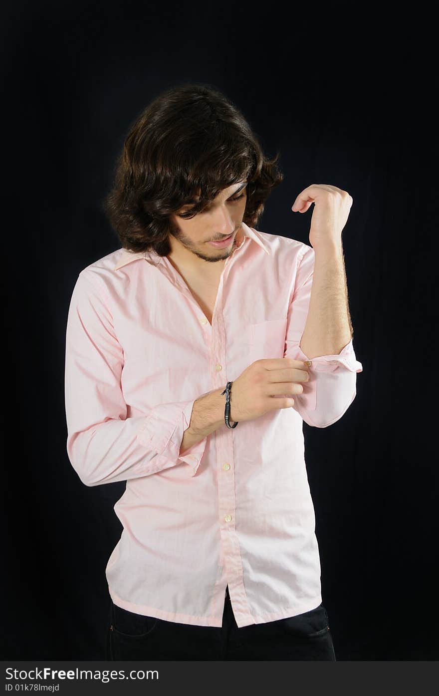 Portrait of young casual man isolated over black